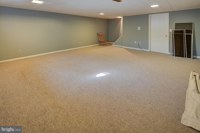 basement featuring light colored carpet