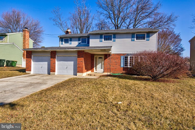 view of front property with a garage and a front yard