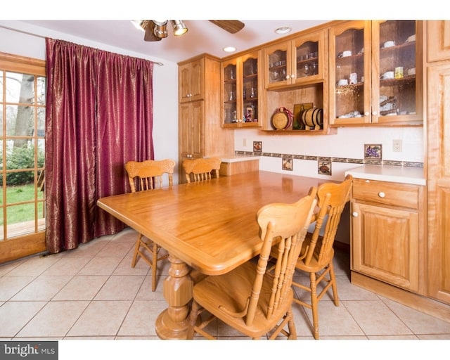 dining area with light tile patterned floors and a healthy amount of sunlight