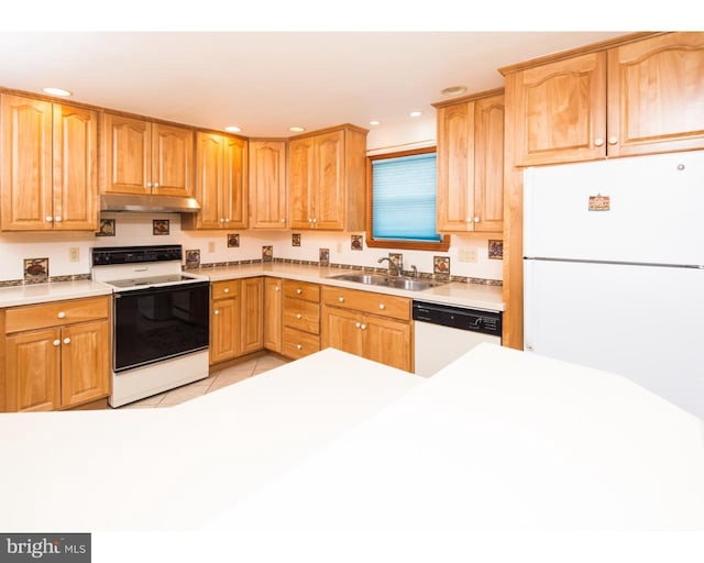 kitchen with light tile patterned flooring, white appliances, and sink