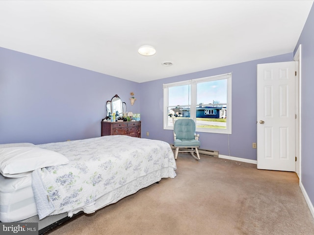 bedroom with carpet floors and a baseboard radiator