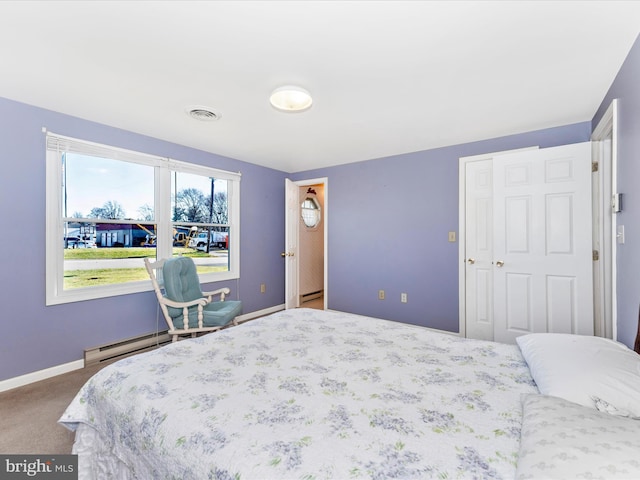 bedroom featuring carpet flooring and baseboard heating