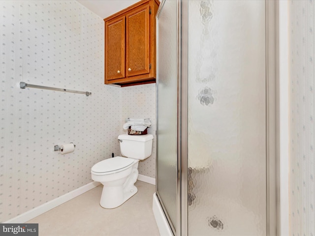 bathroom featuring an enclosed shower and toilet