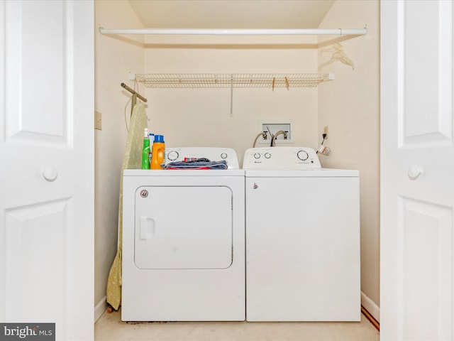 washroom with washer and dryer