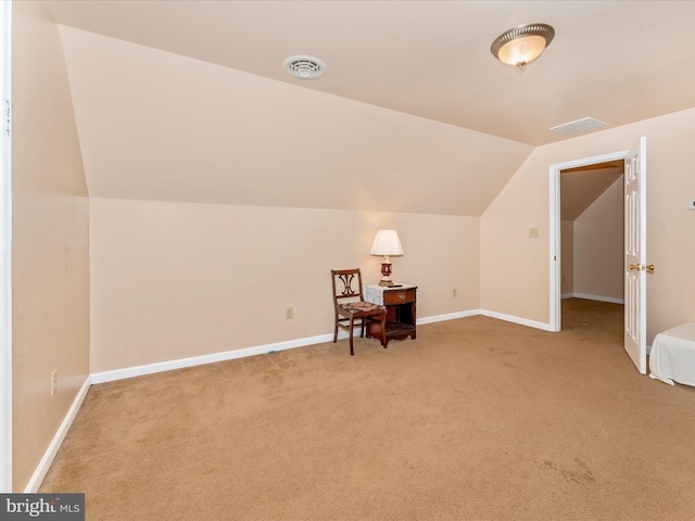 bonus room featuring lofted ceiling and carpet floors