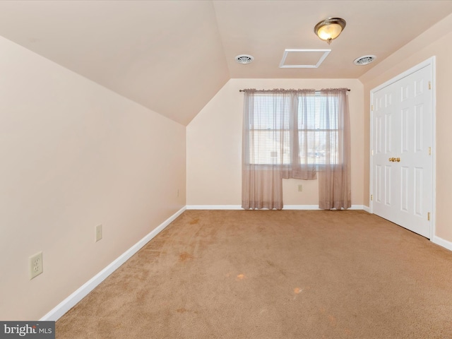 bonus room featuring carpet flooring and vaulted ceiling