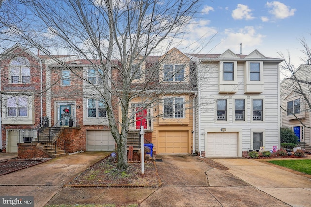 townhome / multi-family property featuring a garage