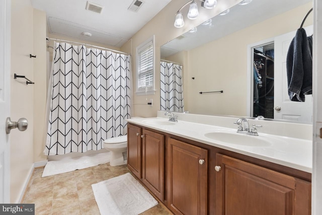 bathroom with a shower with curtain, vanity, and toilet