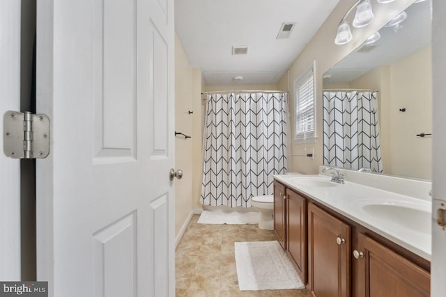 bathroom with a shower with curtain, vanity, toilet, and tile patterned flooring