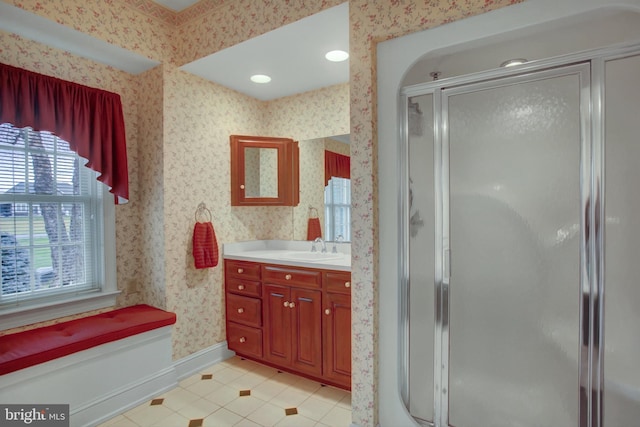 bathroom with tile patterned floors, vanity, and walk in shower