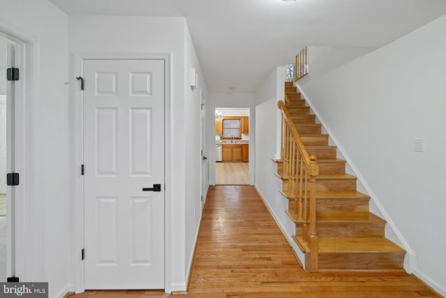 staircase featuring hardwood / wood-style floors