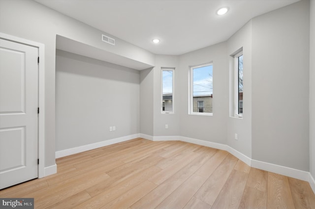 unfurnished room featuring light wood-type flooring