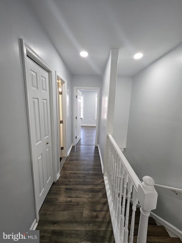 hallway featuring dark hardwood / wood-style flooring