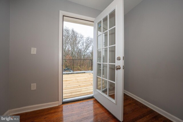 entryway with plenty of natural light and dark hardwood / wood-style floors