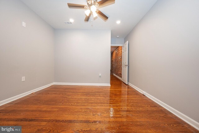 unfurnished room featuring ceiling fan and wood-type flooring