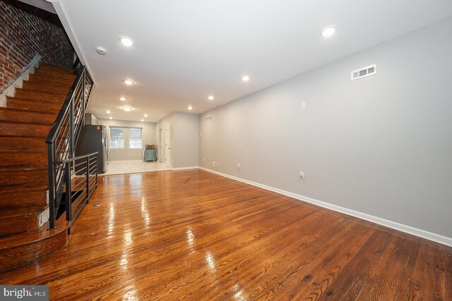 unfurnished living room featuring light hardwood / wood-style floors