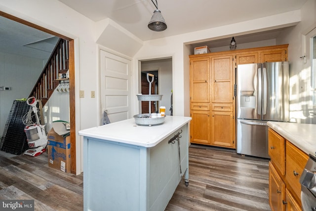 kitchen featuring stainless steel fridge, a center island, and dark hardwood / wood-style flooring