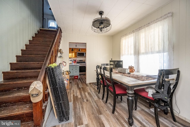 dining area with wood-type flooring