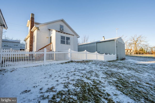 view of snow covered property