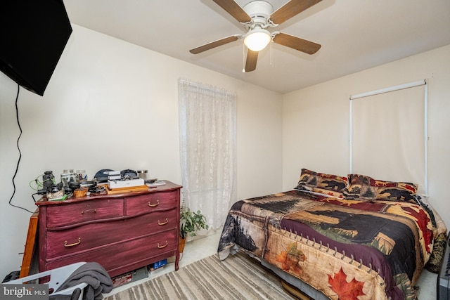 bedroom featuring light colored carpet and ceiling fan