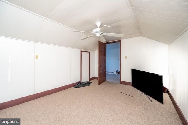 additional living space featuring ceiling fan, carpet floors, and vaulted ceiling