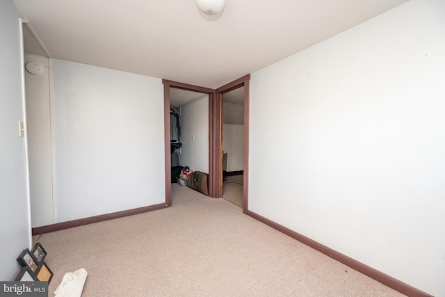 empty room featuring light colored carpet