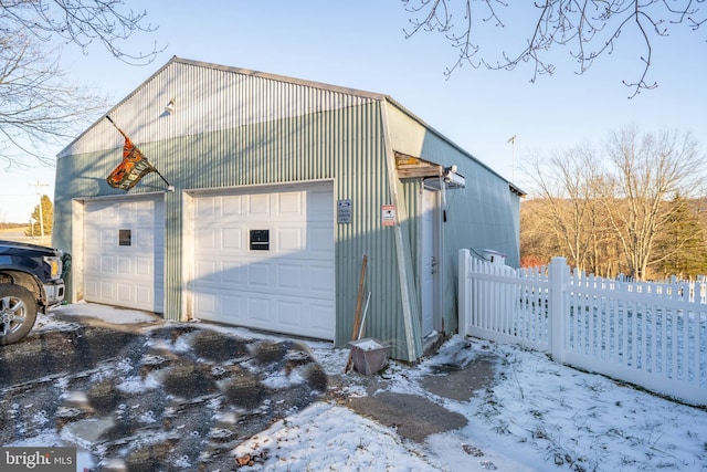 view of snow covered garage