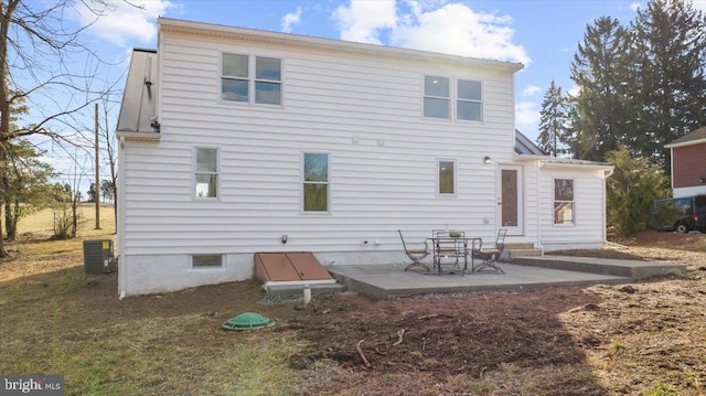 back of house featuring a patio area and central air condition unit