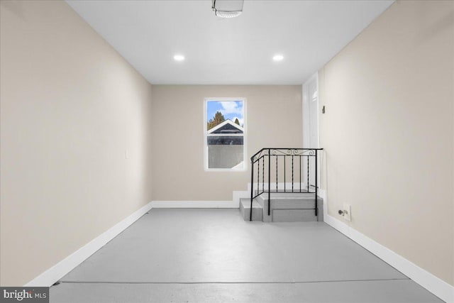 empty room with concrete flooring