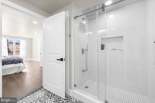 bathroom featuring tile patterned flooring and a shower with shower door