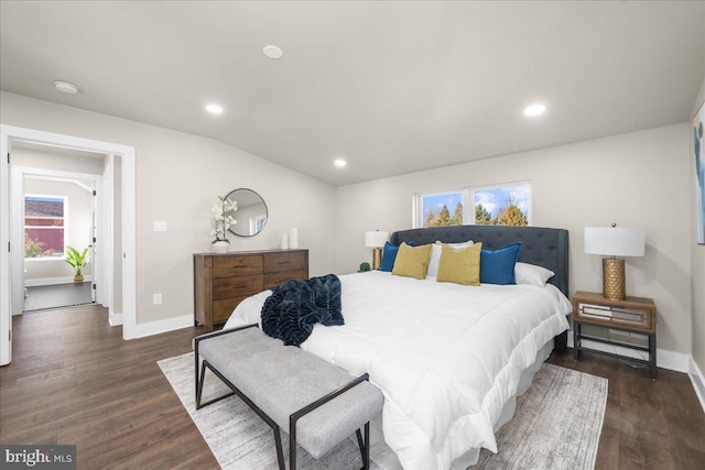 bedroom featuring dark hardwood / wood-style flooring and vaulted ceiling