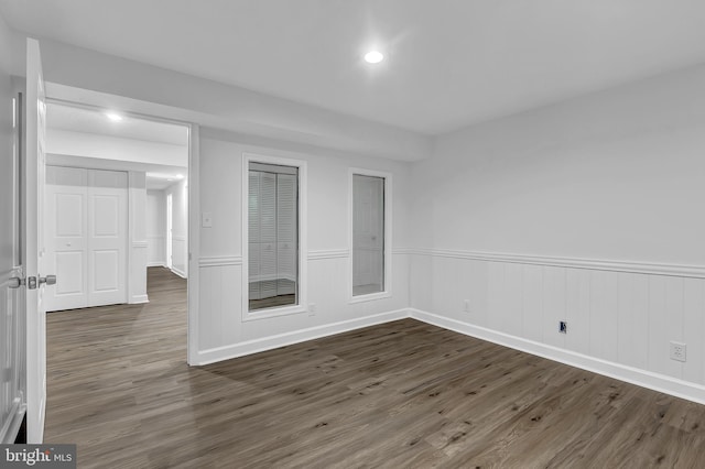 spare room with dark hardwood / wood-style floors