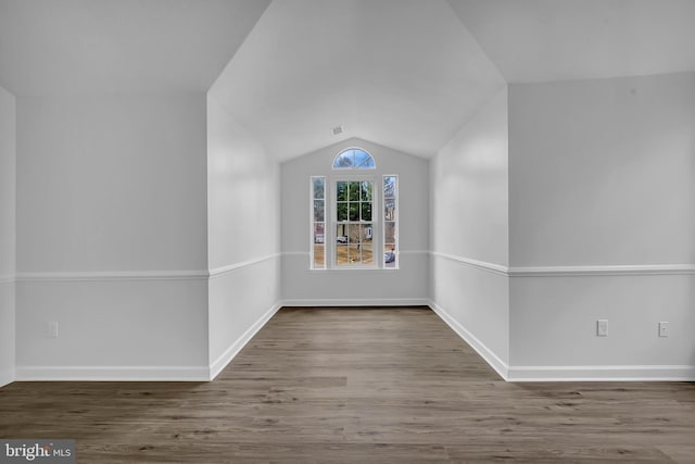 bonus room featuring hardwood / wood-style flooring and lofted ceiling