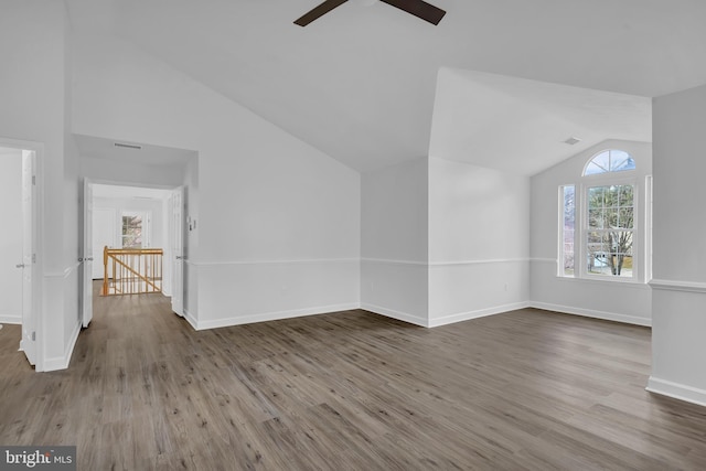 additional living space with ceiling fan, wood-type flooring, and lofted ceiling