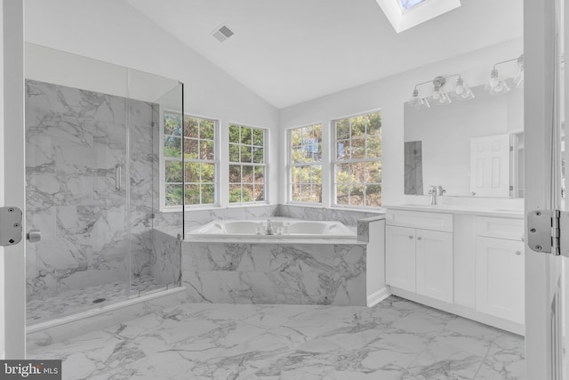 bathroom with separate shower and tub, lofted ceiling with skylight, and vanity