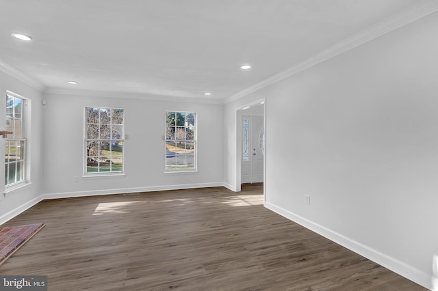 unfurnished room with crown molding and dark wood-type flooring