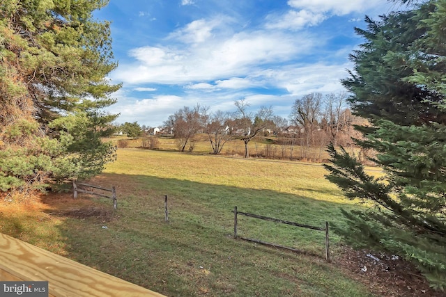 view of yard with a rural view