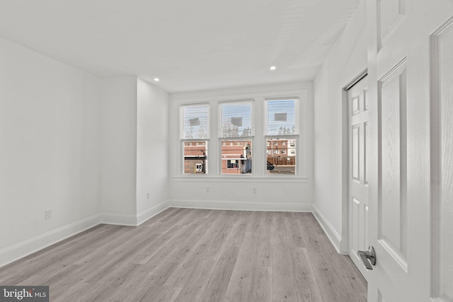 unfurnished room featuring light hardwood / wood-style floors