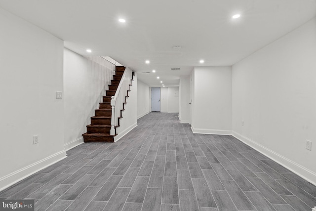 basement featuring hardwood / wood-style floors