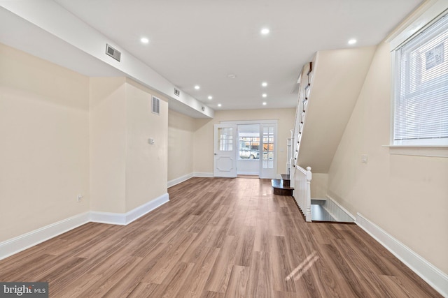 unfurnished living room featuring hardwood / wood-style floors