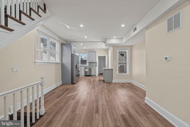 unfurnished living room featuring dark wood-type flooring