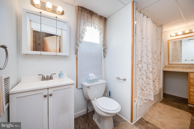 full bathroom with vanity, wood-type flooring, shower / bath combo, and toilet