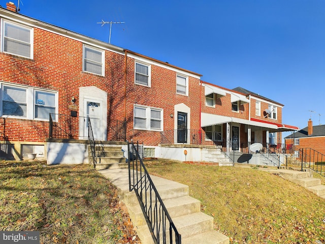 view of property with a front lawn