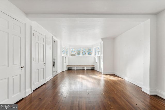 unfurnished bedroom featuring dark wood-type flooring