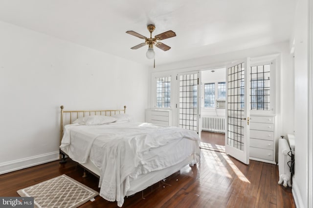 bedroom featuring radiator, ceiling fan, and dark hardwood / wood-style floors