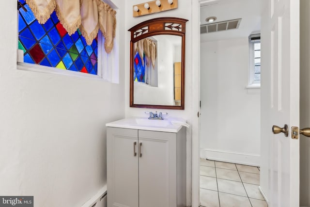 bathroom featuring tile patterned flooring and vanity