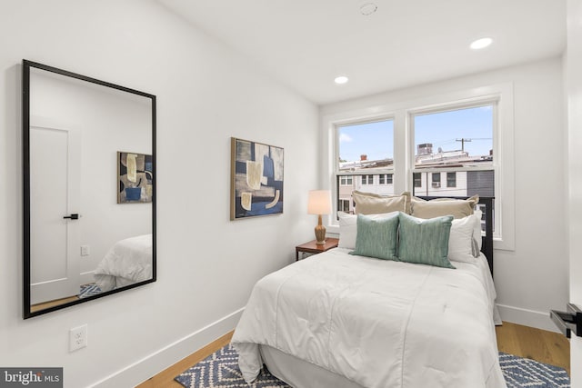 bedroom with wood-type flooring