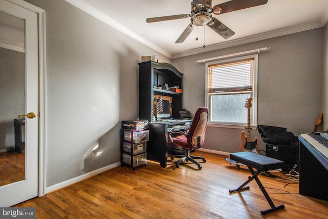 office space featuring light hardwood / wood-style floors, ceiling fan, and crown molding