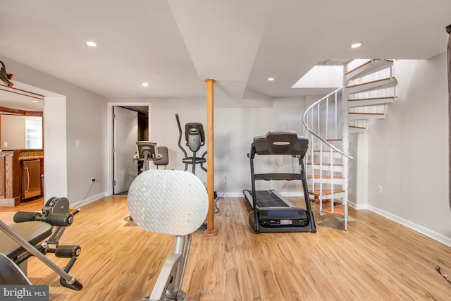 workout area featuring light wood-type flooring