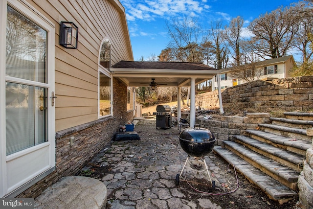 view of patio featuring ceiling fan and a grill